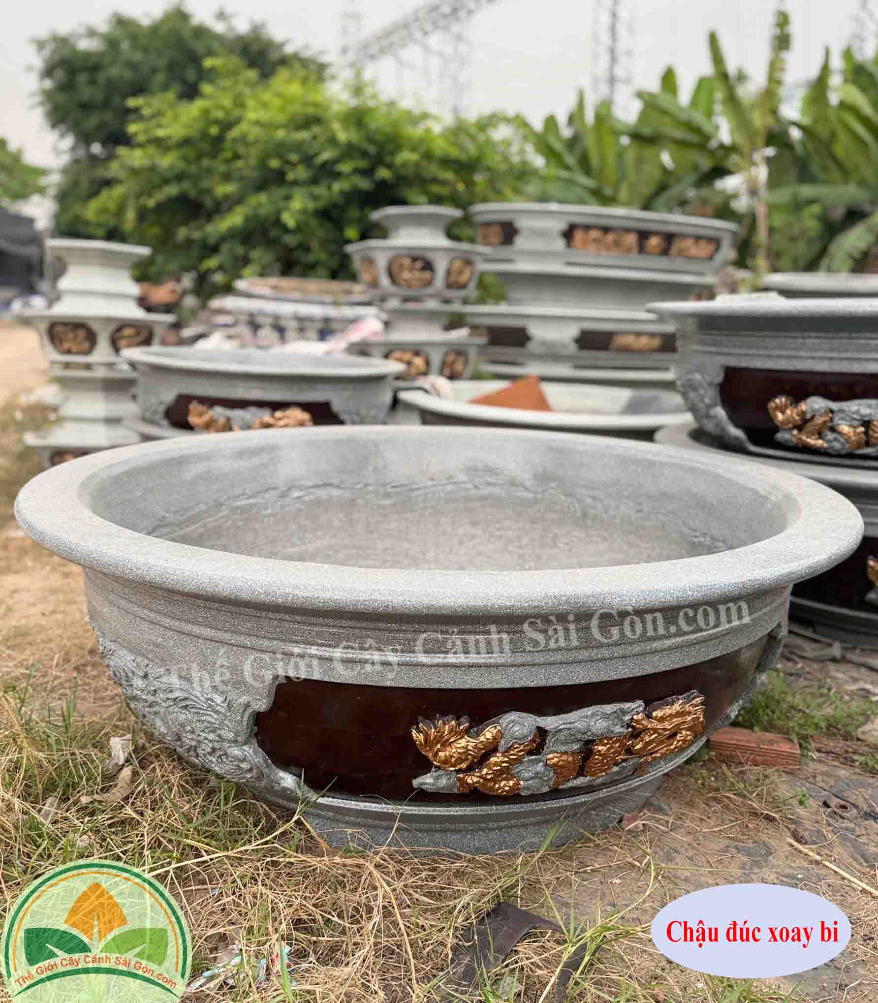 Chậu xi măng xoay bi